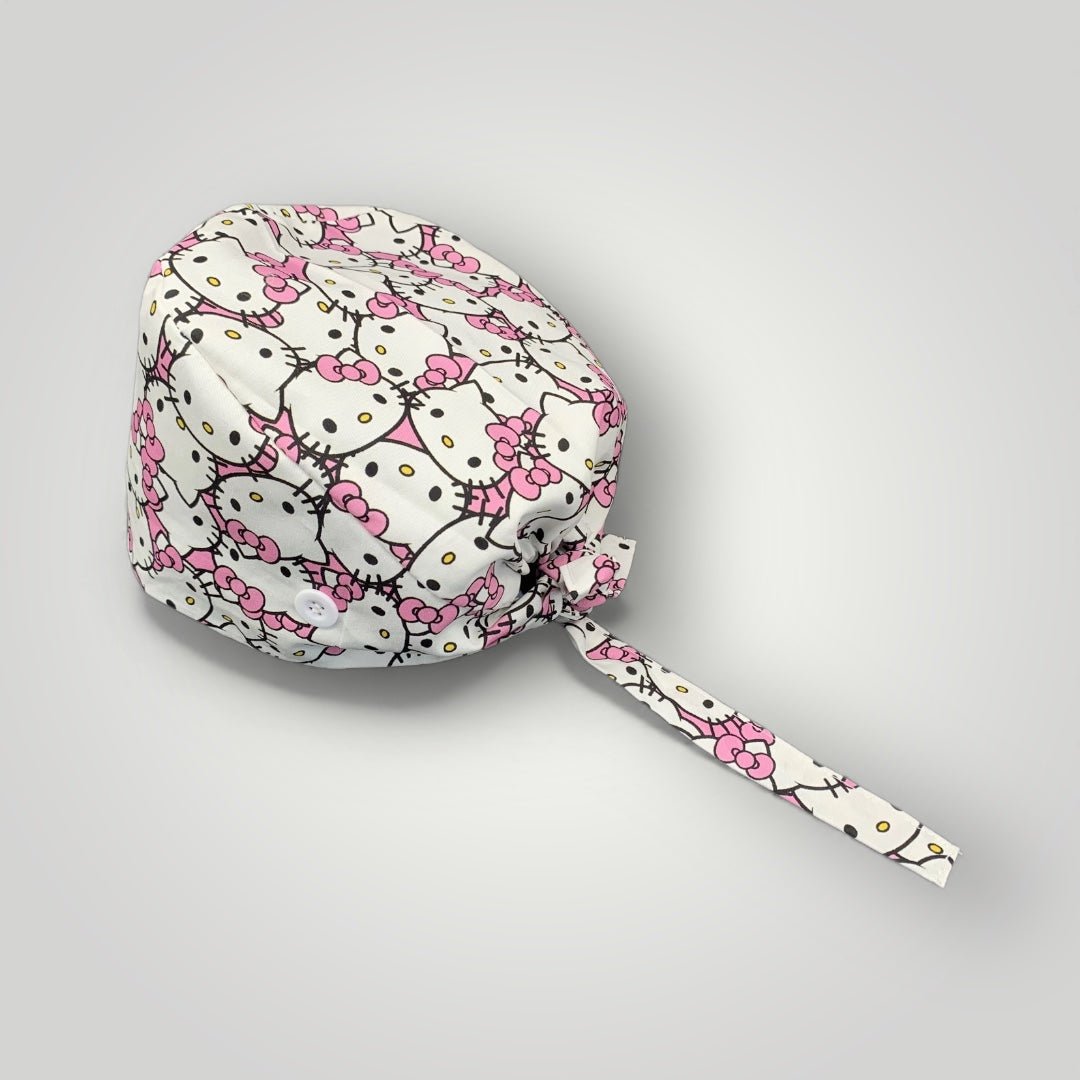 Woman wearing a Hello Kitty scrub cap in a medical setting